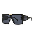 Large frame sunglasses with widened legs and patch sunglasses