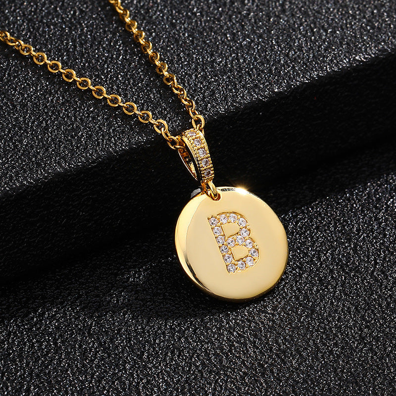 Zircon Initial Disc Necklace Collection
