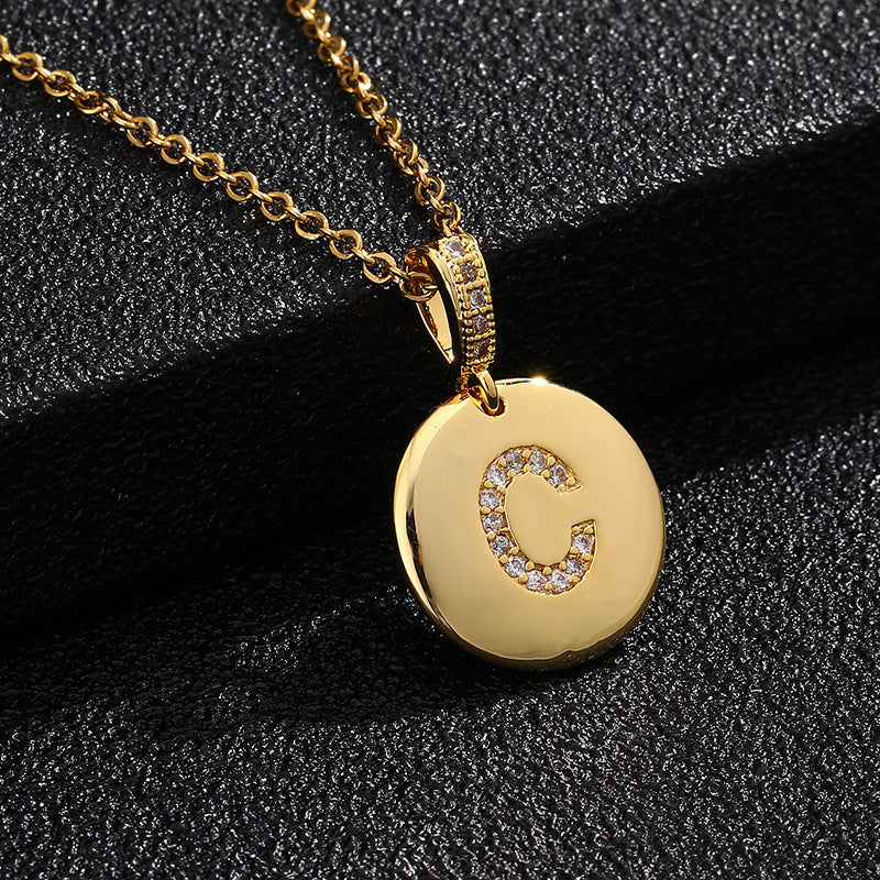 Zircon Initial Disc Necklace Collection